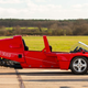 A photo of the side of a Modulo three-wheeled car.